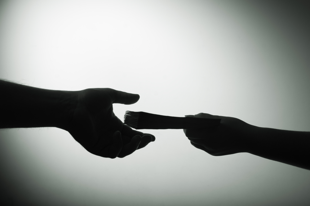 Dark,Economy.,Two,Hands,With,Money