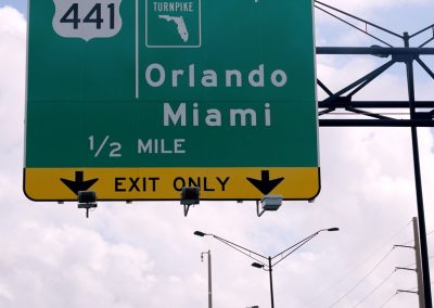 Florida Just Named a 124-Mile Highway After Trump and the Airport Code Is DJT Street,Sign,On,The,Highway,Of,Florida,Showing,Miami,And