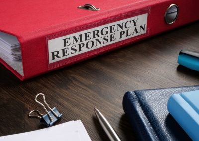 Red,Folder,With,Emergency,Response,Plan,On,The,Desk.