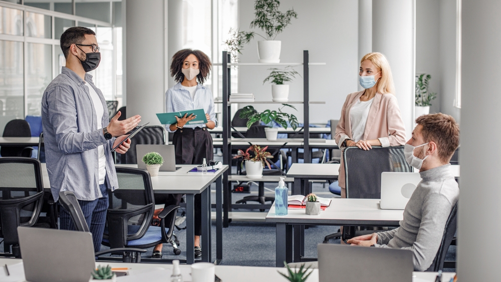 Corporate,Meeting,In,Office,,Multiracial,Workers,In,Protective,Masks,Discussion