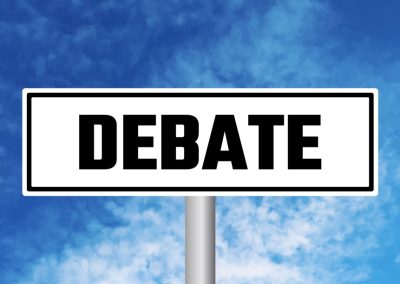 Debate,Road,Sign,On,Blue,Sky,Background