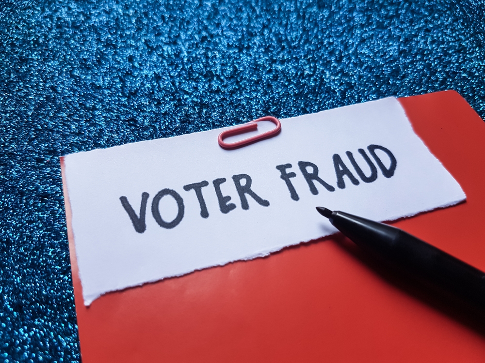 Voter,Fraud,Writting,On,Blue,Background.