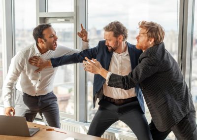 Three,Men,In,Suits,Are,Engaged,In,A,Heated,Argument