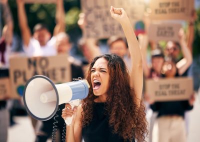 This Florida Democrat Who Got Arrested Protesting Ron DeSantis Just Received a Trial Date Woman,,Megaphone,And,Shouting,With,Protest,Crowd,,Change,Or,Environment