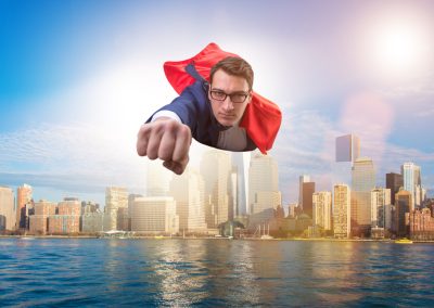 Superhero,Businessman,Flying,Over,The,City
