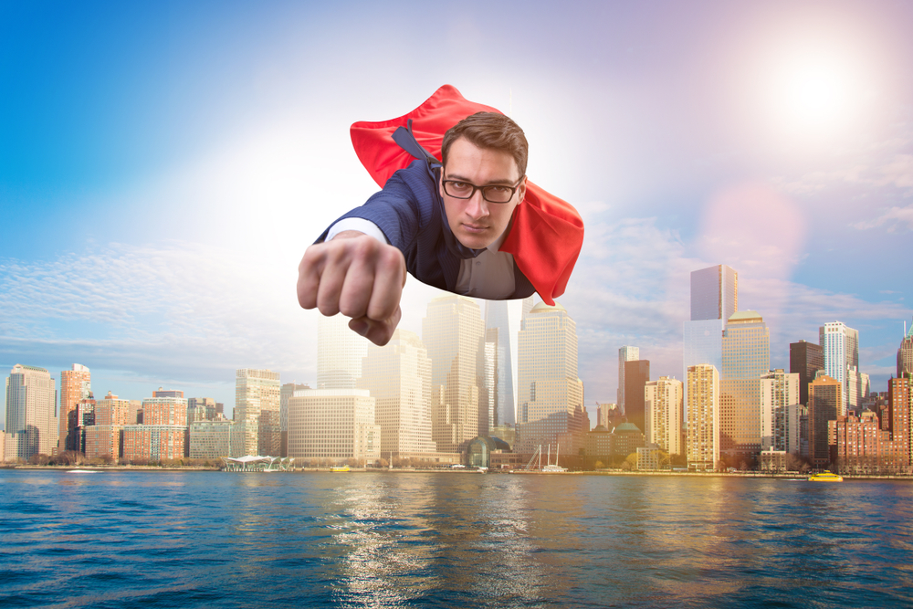Superhero,Businessman,Flying,Over,The,City