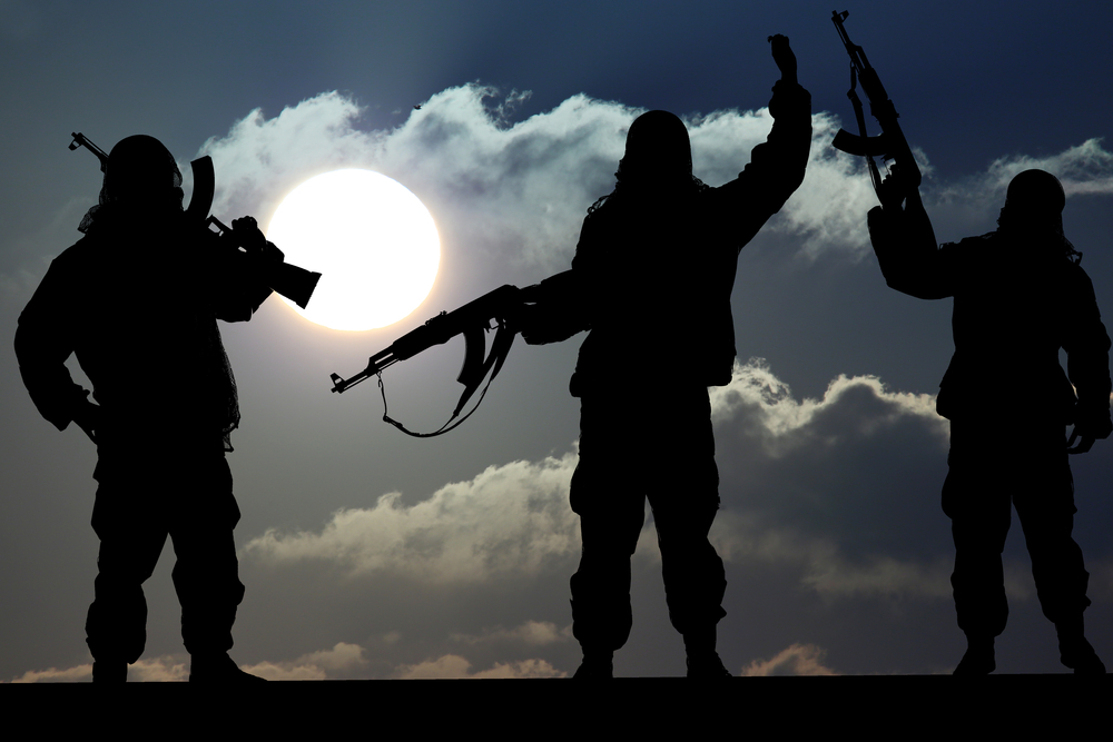 Silhouette,Of,Military,Soldier,Or,Officer,With,Weapons,At,Sunset.