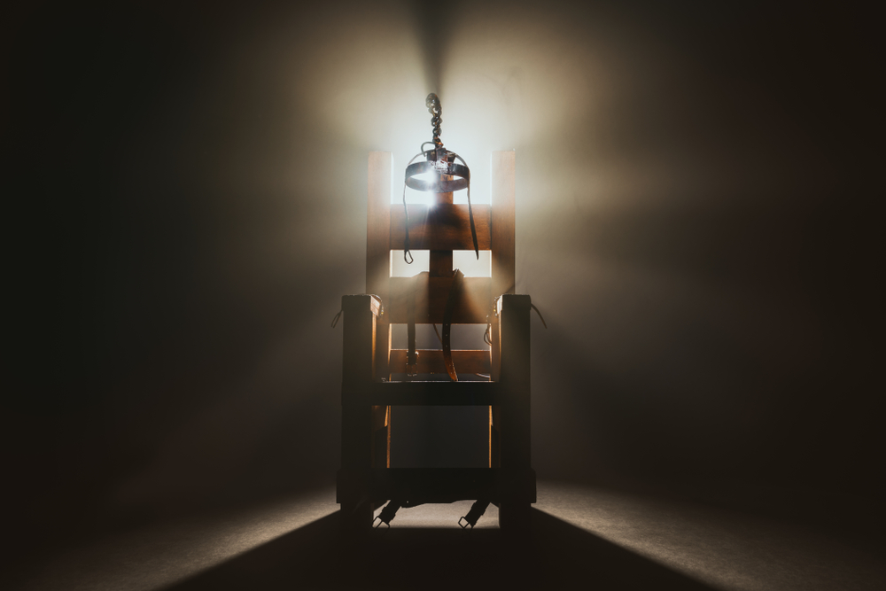 High,Contrast,Image,Of,An,Electric,Chair,Scale,Model,On
