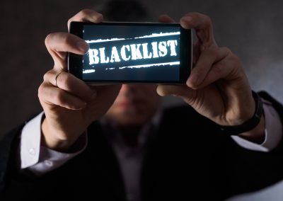 The,Man,Is,Holding,A,Smartphone,In,His,Hands,,Facing
