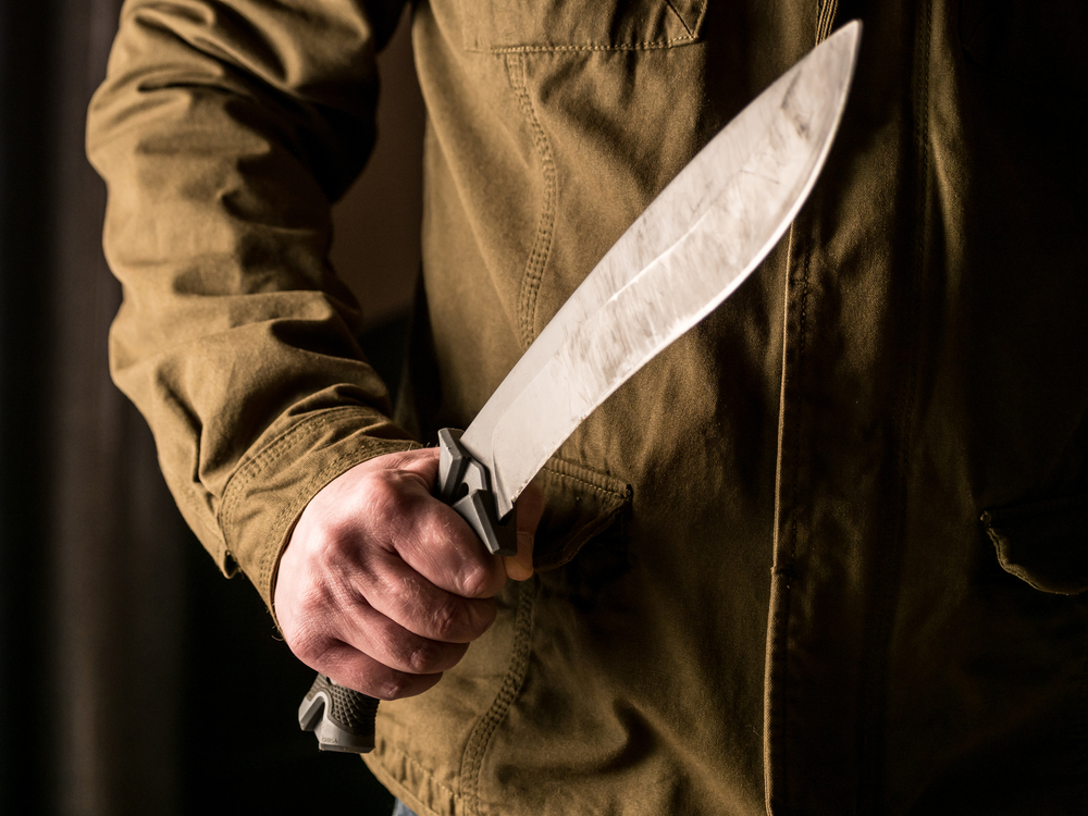 Man,Holding,A,Machete,In,His,And,In,A,Threatening