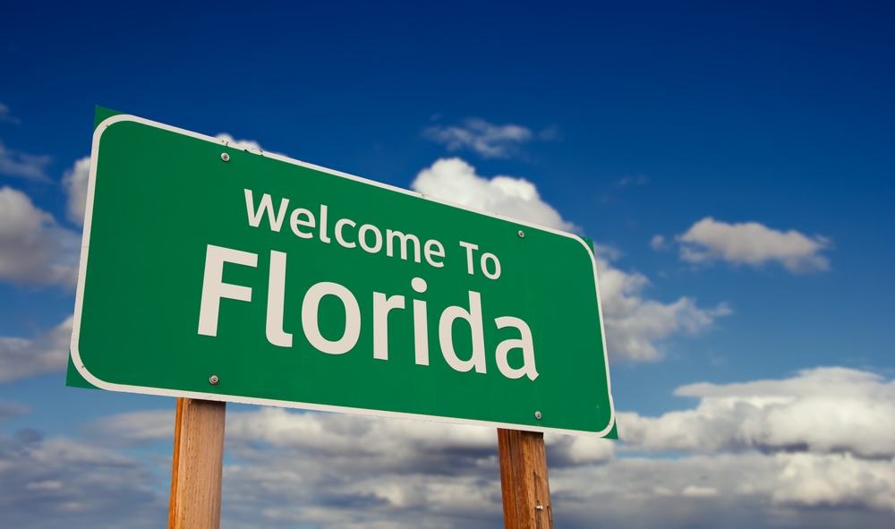 Welcome,To,Florida,Green,Road,Sign,Over,Blue,Sky,With