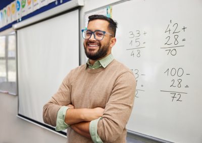 A Florida Geometry Teacher Showed Up to Meet a 14-Year-Old Girl and Found Handcuffs Waiting Instead Happy,Teacher,Explaining,Mathematics,At,Whiteboard,In,Classroom.,Portrait,Of