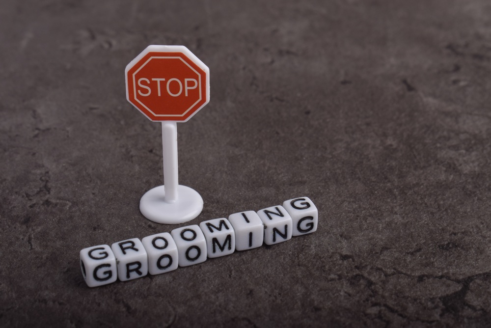 Grooming,Word,Formed,With,Letter,Beads,And,A,Red,Stop