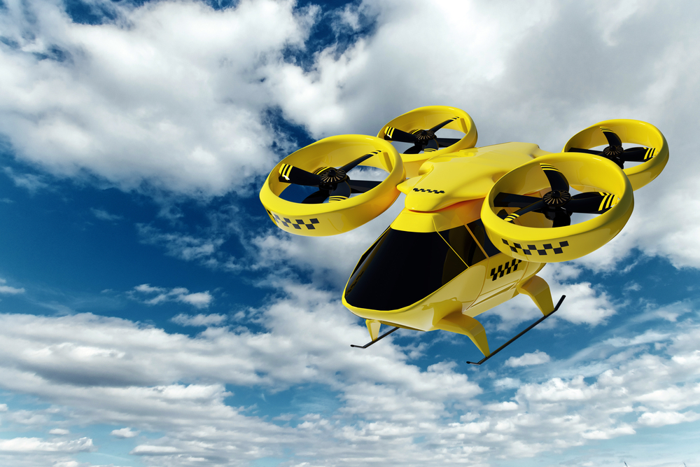 Yellow,Flying,Taxi,Against,The,Sky,,City,Electric,Transport,Drone.
