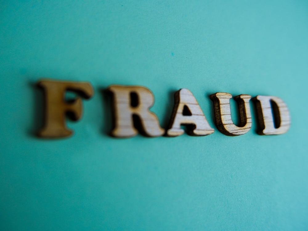 Fraud;,Wooden,Letters,With,”fraud”,Text,Of,Concept.,Isolated,On