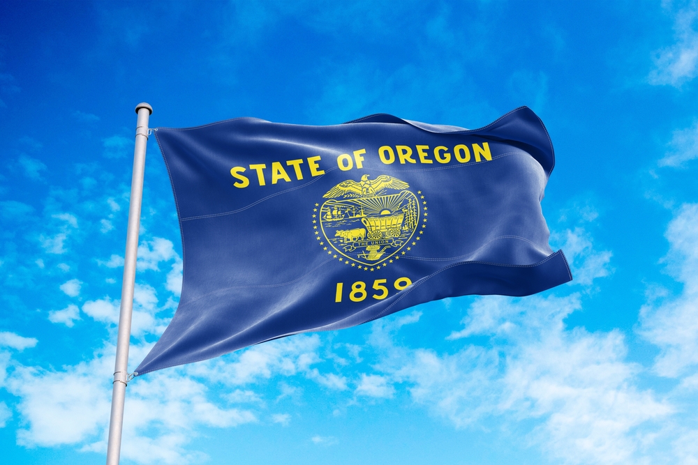 Oregon,Flag,Waving,In,The,Wind,,Blue,Sky,Background