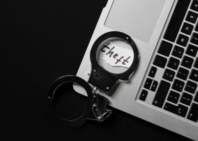 Florida’s CFO Just Arrested 7 More Suspects Who Used Government Jobs to Steal From Their Own Families Paper,With,Word,Theft,,Handcuffs,And,Laptop,On,Dark,Background