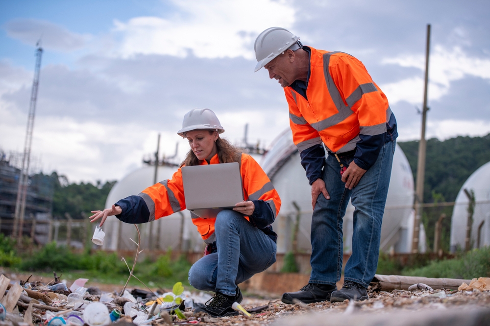 Environmental,Scientists,Or,Workers,,Wearing,Safety,Helmets,And,Gloves,,Examining