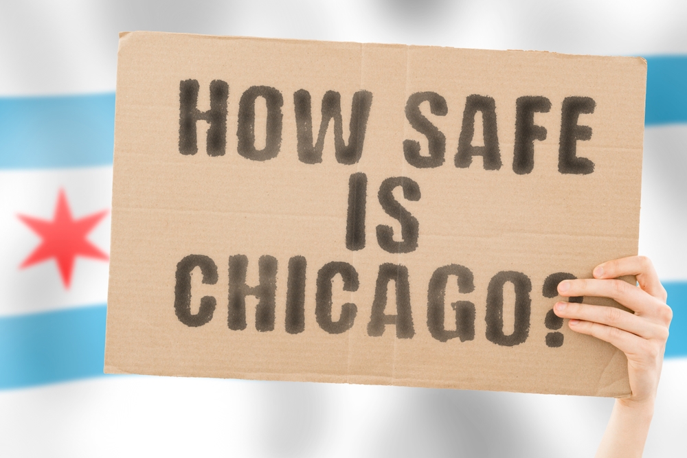 Man’s,Hand,Clutches,A,Banner,Questioning,’,How,Safe,Is