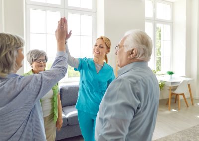 Senior,People,Retirement,Home,Activity,,High,Five,With,Skilled,Nurse,